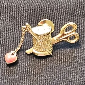 Vintage avon Brooch. Needle and thread with hanging heart